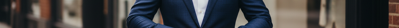 Well-dressed man in a classic navy suit representing smart shopping for men’s suits.