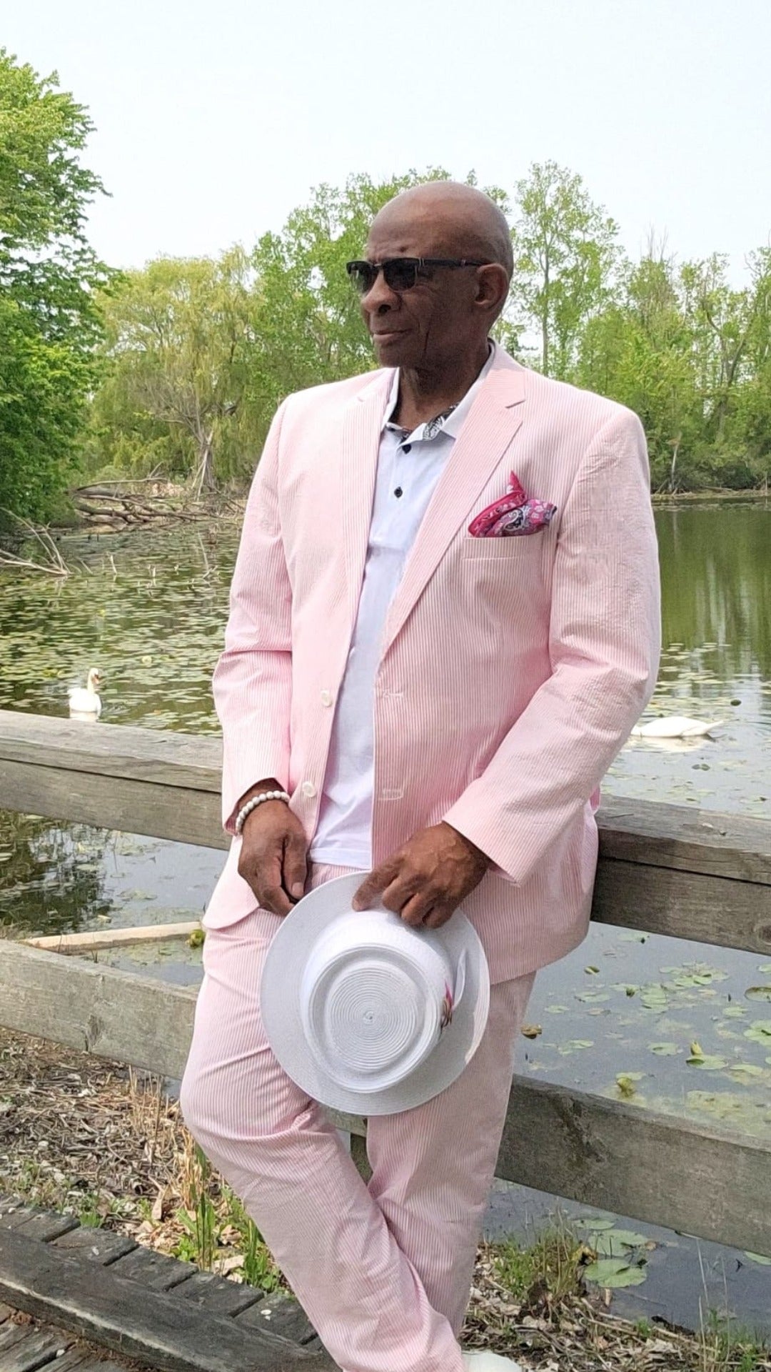 man wearing pink seersucker suit