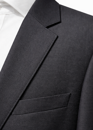 Hugo Boss Textured Black Notch Lapel Slim Fit Super 100’s Wool 2-Button Suit 46L - The Suit Depot